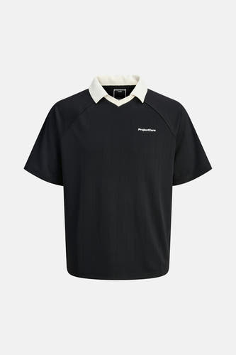 Polo noir à manches courtes de CORE BY JACK & JONES, avec col blanc et rayures verticales.