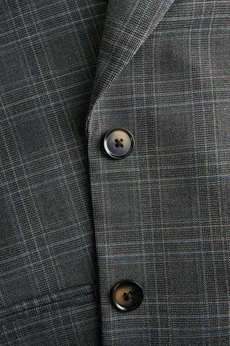 Blazer gris de JJXX avec un motif à carreaux et deux boutons, détail.