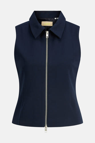 Blouse bleue sans manches JJXX avec un col et une fermeture éclair argentée.
