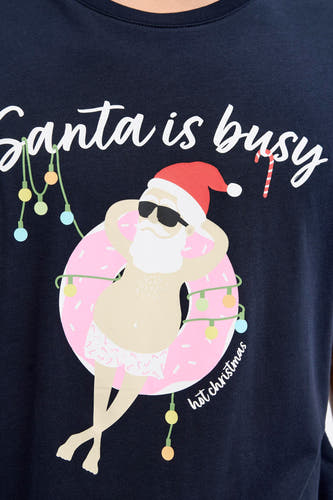 T-shirt bleu à manches courtes d'ORIGINALS BY JACK & JONES, avec une image graphique d'un père Noël détendu dans un maillot de bain.