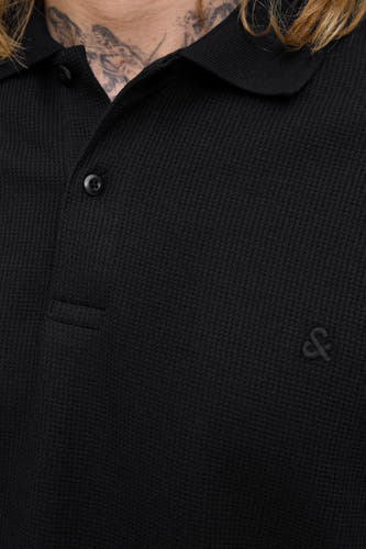 Sweat-shirt noir à col V de PREMIUM BLUE par JACK & JONES, avec un fin motif côtelé.