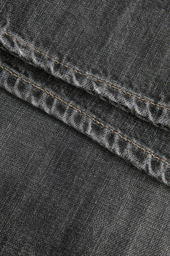 Jean droit bleu marine de JJXX, avec des points visibles et une texture denim, coupé près du corps.