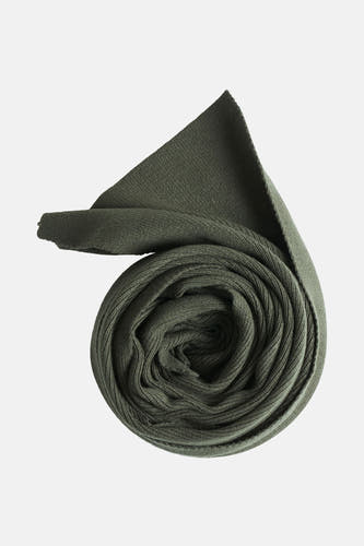 Manteau d'hiver vert de ACCESSORIES BY JACK & JONES, roulé avec une texture visible.