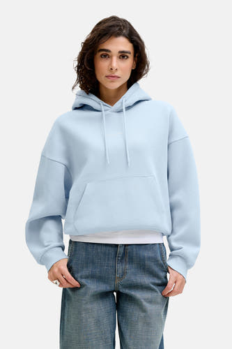 Sweatshirt à capuche bleu de JJXX Studio, avec manches longues et une poche kangourou.