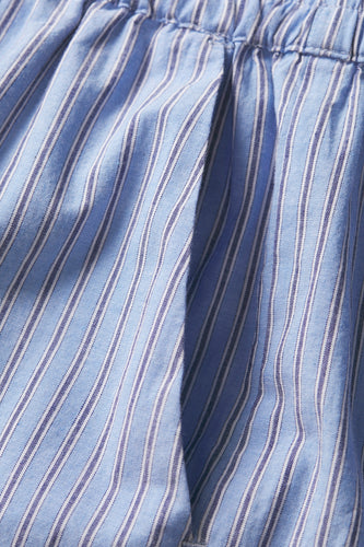 Gestreepte blauwe katoenen stof met elastische tailleband.