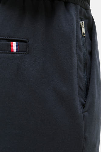 Pantalon bleu de JACK & JONES JEANS INTELLIGENCE, avec une poche zippée et un détail à rayures.