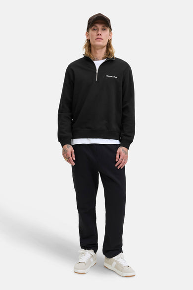 Gilet noir d'Originals par Jack & Jones, avec une fermeture éclair courte et du texte blanc sur la poitrine.