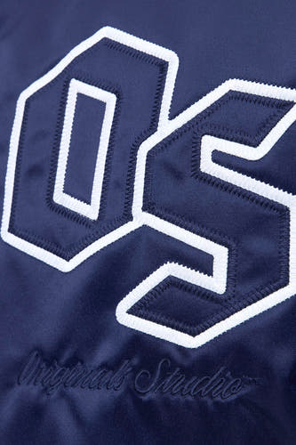 Veste bleue d'ORIGINALS BY JACK & JONES, avec des lettres et un logo brodés sur la devanture.