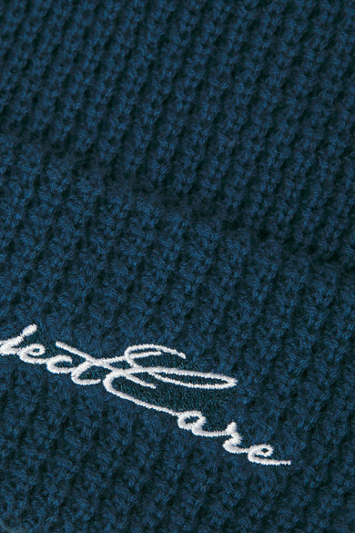 Casquette bleue d'ACCESSORIES BY JACK & JONES, avec une texture tricotée et des détails brodés.