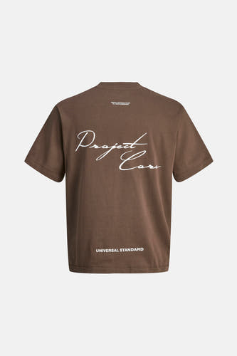 T-shirt brun à manches courtes de CORE BY JACK & JONES, avec une impression blanche sur le dos.