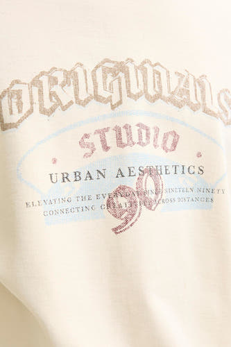 Gilet beige d'ORIGINALS BY JACK & JONES avec une impression graphique vintage et un col rond.