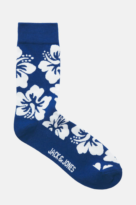 Chaussettes bleues d'ACCESSORIES BY JACK & JONES, avec un motif floral et le nom de la marque sur le côté.