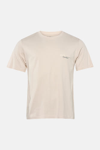T-shirt beige à manches courtes de CORE by JACK & JONES, avec un petit imprimé texte sur la poitrine.