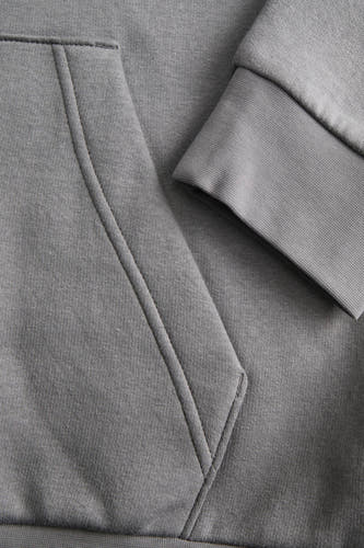 Pull-over gris avec capuche de CORE BY JACK & JONES, doté d'une poche kangourou et de manches côtelées.