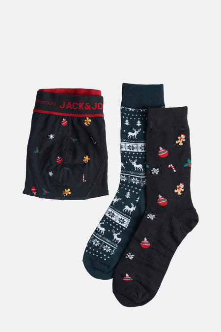 Chaussettes noires d'ACCESSORIES BY JACK & JONES avec des motifs de Noël comme des boules de Noël, un homme gingerbread et des flocons de neige.