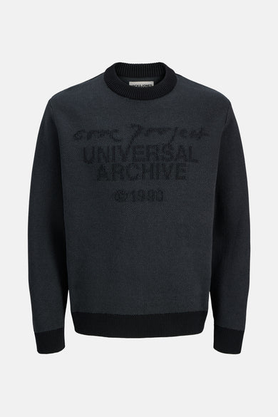 Sweat-shirt noir à col rond de CORE par JACK & JONES, avec un motif textuel tissé sur la partie avant.