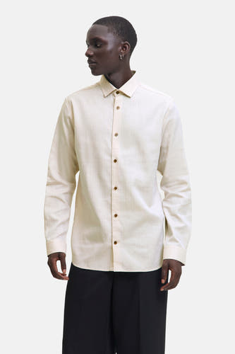 Chemise beige à longues manches de PREMIUM by JACK & JONES, unie et complète avec des boutons bruns.