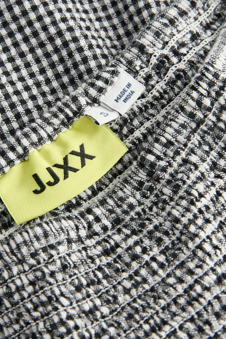 Jupe multicolore de JJXX, avec un motif à carreaux noir et blanc fin et des détails élastiques.