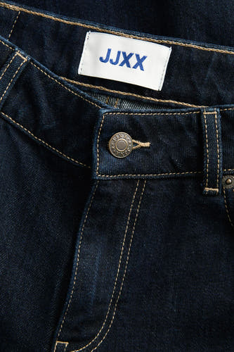 Jean bleu marine en denim de JJXX, avec des surpiqures marron clair et une fermeture à glissière.