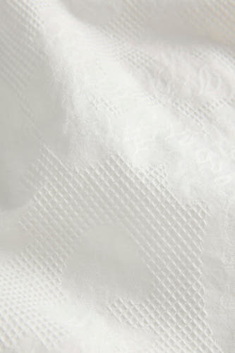 Short blanc JJXX avec des motifs subtils à carreaux et floraux tissés.