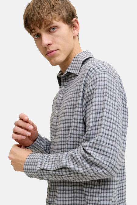 Chemise grise à manches longues de JJREBEL, avec un motif à carreaux et des manches longues.