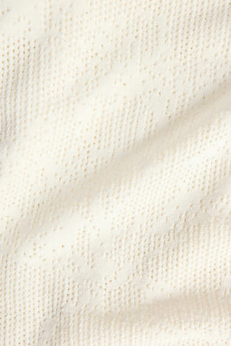 Jupe blanche JJXX avec un motif ajour fin en maille et des plis subtils.