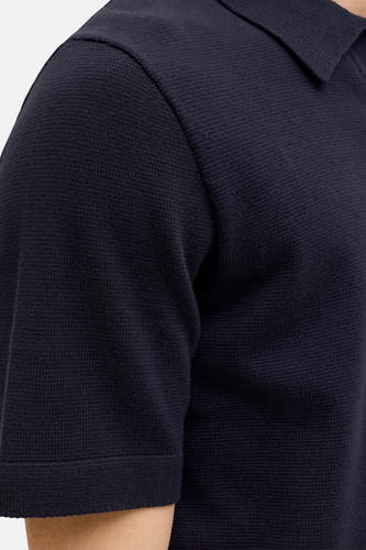 Polo bleu à manches courtes de PREMIUM by JACK & JONES, avec une fine texture gaufrée.