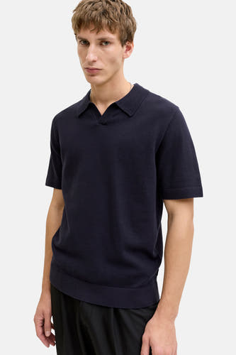 Polo bleu à manches courtes de PREMIUM by JACK & JONES, avec une structure en maille fine et des bords côtelés.