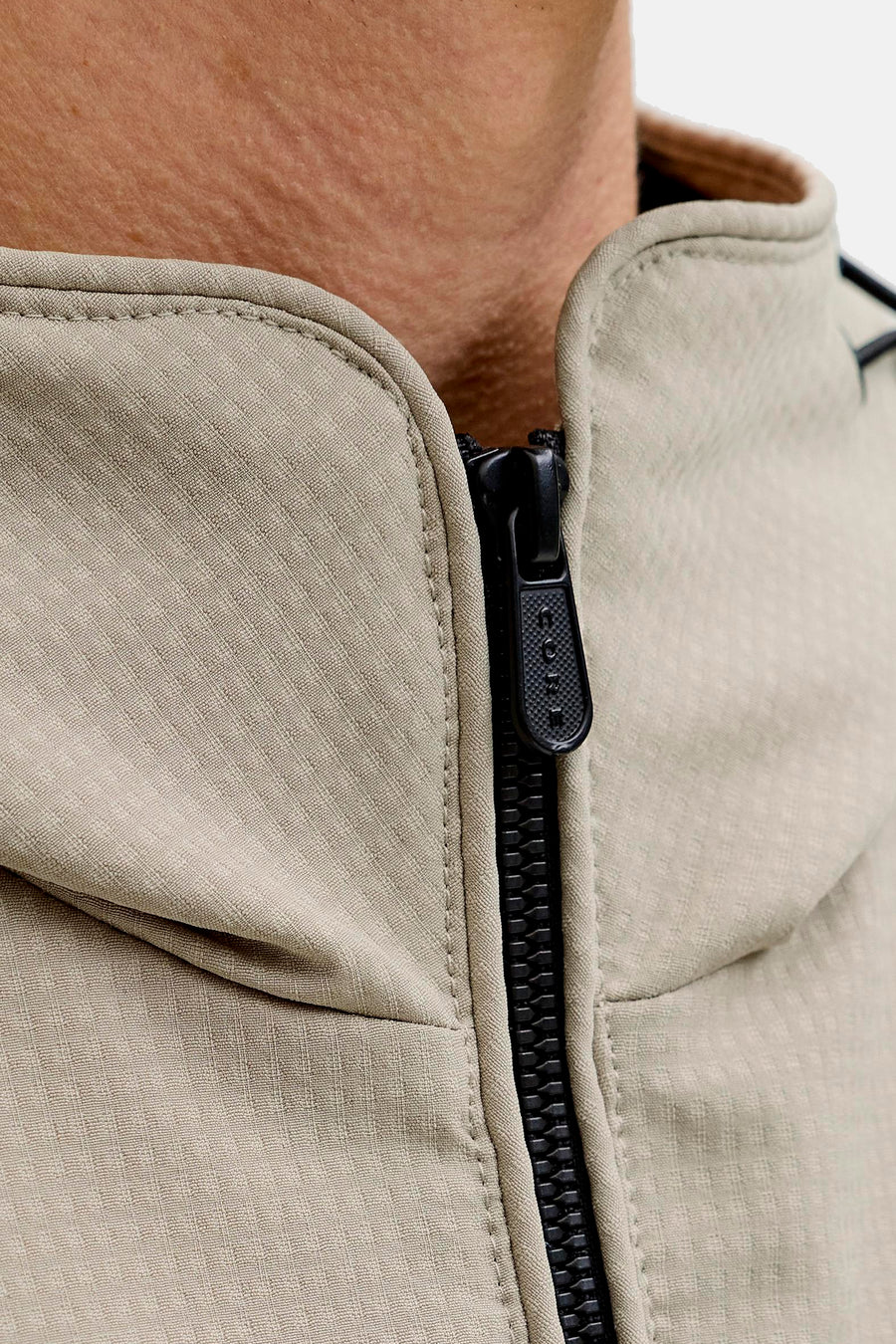 Manteau court beige de CORE BY JACK & JONES avec fermeture éclair et col montant.