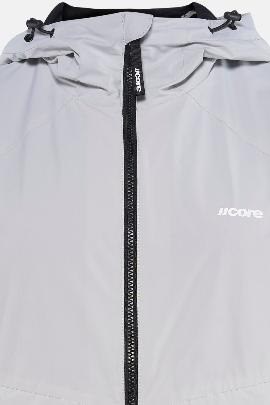 Veste courte grise de CORE BY JACK & JONES, avec fermeture éclair noire et logo sur le devant, et cordons de serrage à la capuche.