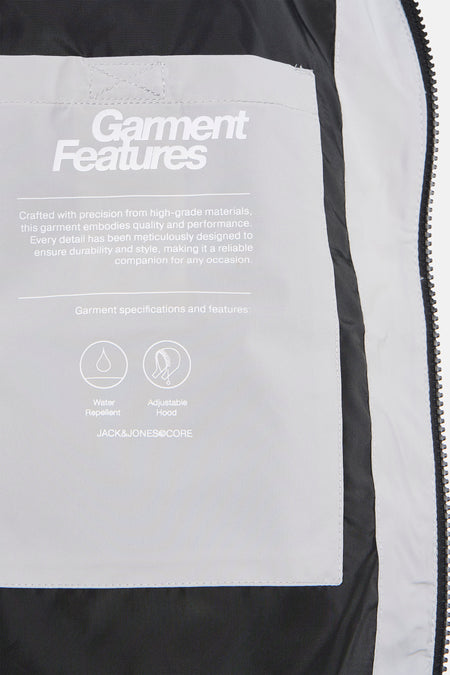 Veste courte grise de CORE BY JACK & JONES, avec les caractéristiques du produit imprimées sur une étiquette.