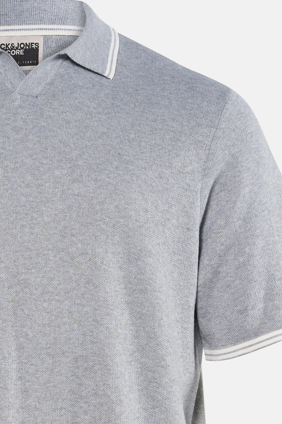 Grijze polo met korte mouwen van CORE BY JACK & JONES, met witte accenten aan de kraag en mouwen.