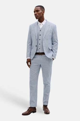 Blauwe kostuumbroek van PREMIUM by JACK & JONES, met bruine riem en bruine schoenen.