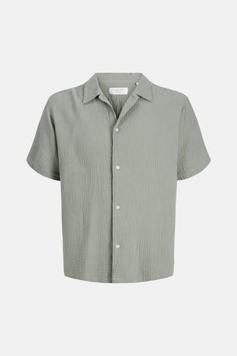 Chemise verte à manches courtes de ORIGINALS BY JACK & JONES, avec une texture côtelée fine et des boutons blancs.