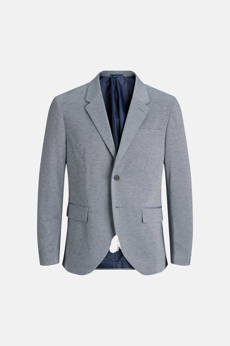 Blazer bleu de PREMIUM by JACK & JONES, avec une texture subtile et une doublure bleu foncé à pois.