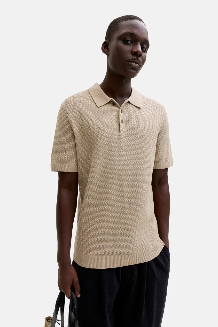 Beige polo met korte mouwen van PREMIUM BLUE by JACK & JONES, met een subtiel textuurpatroon.