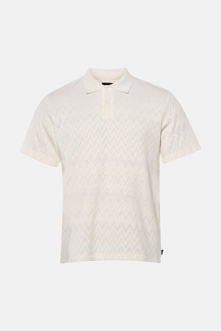 Polo écru de PREMIUM by JACK & JONES, tricotée avec un motif zigzag ajouré et une fermeture à boutons.