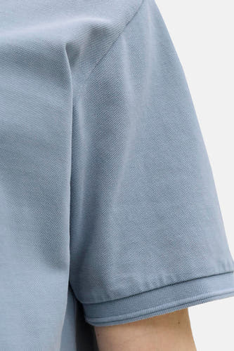 Polo bleue de PREMIUM BLUE by JACK & JONES, à manches courtes et à la texture fine.