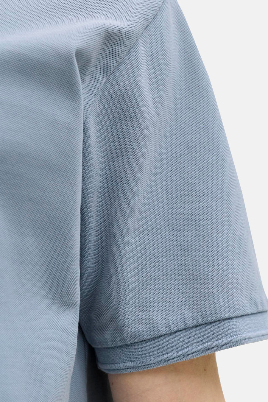 Polo bleue de PREMIUM BLUE by JACK & JONES, à manches courtes et à la texture fine.
