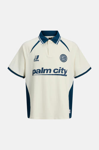 Polo blanche à manches courtes de CORE BY JACK & JONES, avec des accents bleus sur les manches et le col.