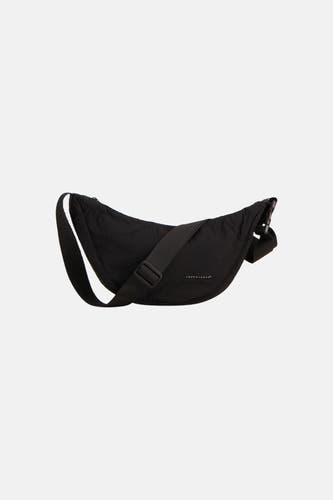 Sac à bandoulière noir d'ACCESSORIES BY JACK & JONES avec un design incurvé, une bandoulière réglable et une étiquette de marque.