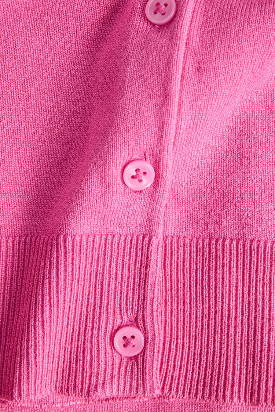 Débardeur rose de JJXX avec fermeture à boutons et côtes verticales sur le bas.