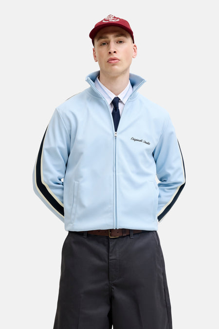 Gilet bleu de ORIGINALS BY JACK & JONES avec fermeture éclair, rayures noires sur les manches et un logo blanc sur la poitrine.