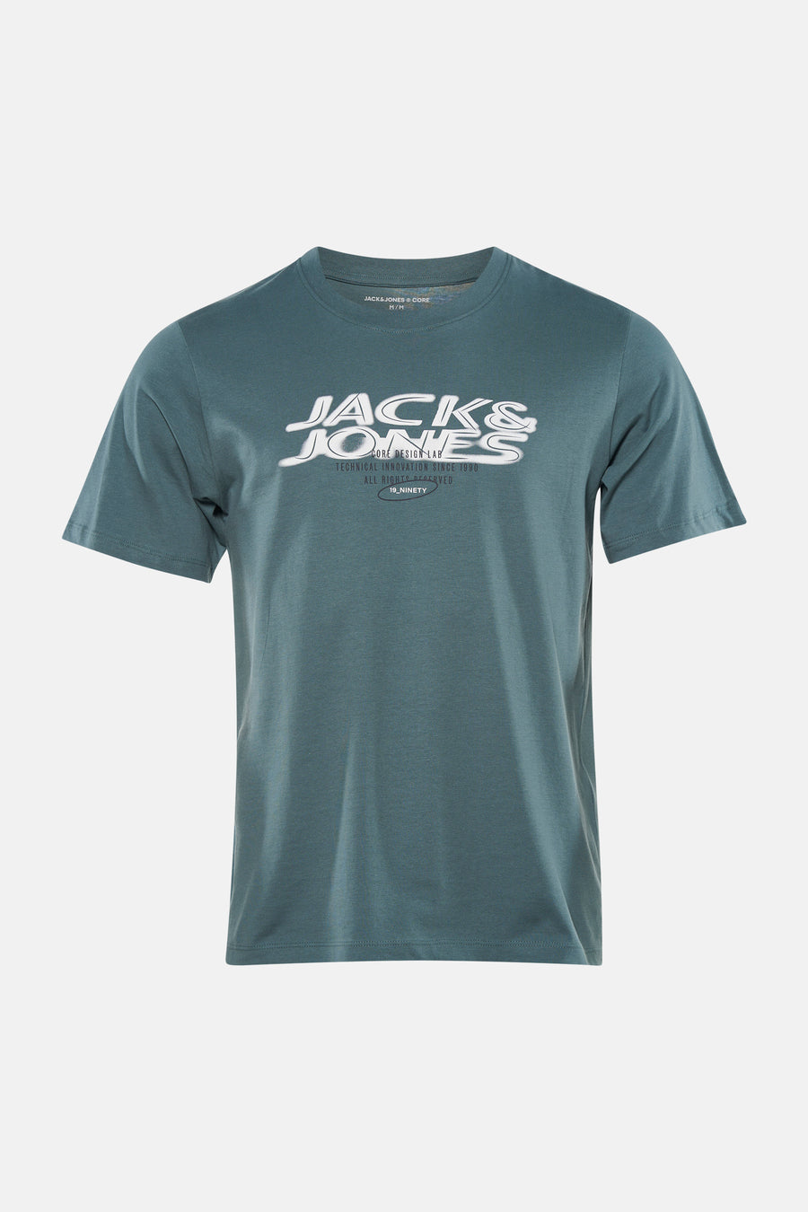 T-shirt vert à manches courtes CORE BY JACK & JONES, porté avec un jean bleu et des baskets noires.