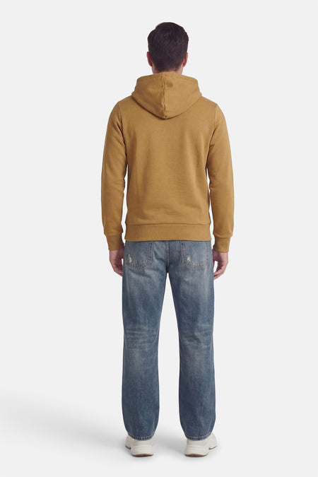 Pull écru à capuche ORIGINALS BY JACK & JONES, vu de dos, avec un jean bleu et des baskets blanches.