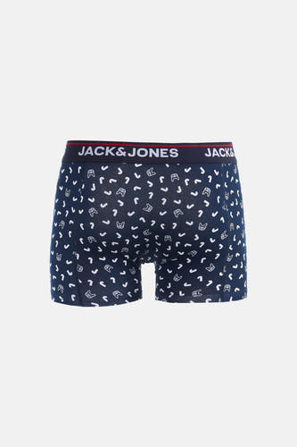 Blauwe boxershort van ACCESSORIES BY JACK & JONES, met witte cartoon honden en j vormige patronen.

