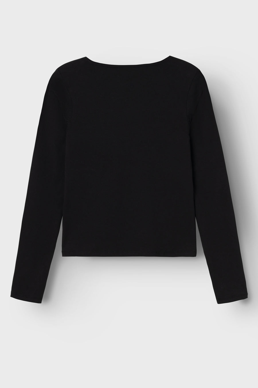 Jean noir de LMTD, denim uni, manches longues et col rond.