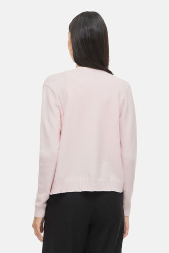 Gilet rose de VILA, à manches longues et porté sur un pantalon noir.