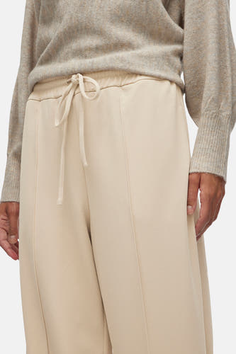 Pantalon beige de VILA, avec cordon de serrage et couture verticale.