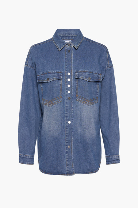 Chemise en denim bleu marine de VILA, avec longues manches et points visibles.